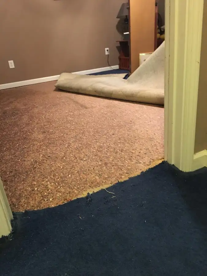 Carpet pad removal revealing water damage during Drying & Dehumidification in Big Bear City